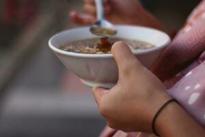 Selective focus of spoonful of chicken soup photo