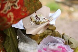 traditional lupis food with sweet and savory taste.with glutinous rice as the main ingredient. photo