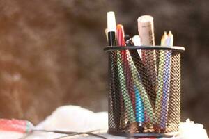 stationery in a black basket case. photo