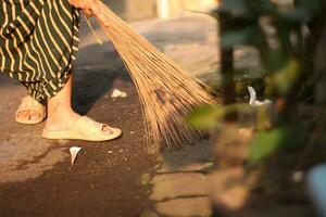 morning activity sweeping the yard. photo