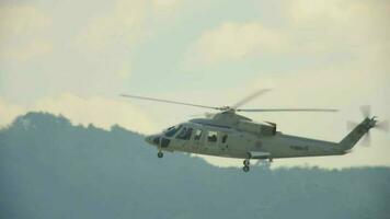 PHUKET, THAILAND NOVEMBER 30, 2019 - Royal Thai Navy Sikorsky S 76B flying over Phuket International airport video