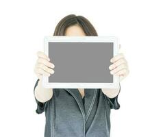 Woman holding up  blank tablet computer photo