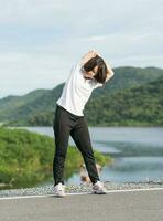 Woman short hair doing exercising outdoor photo