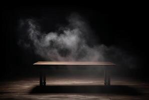 A table with smoke coming out of it and a black background. photo