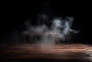 A table with smoke coming out of it and a black background. photo