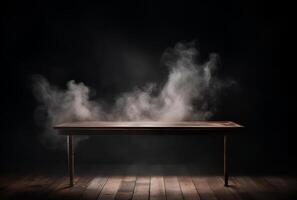 A table with smoke coming out of it and a black background. photo