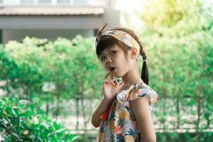 Young asian girl happily posing for a photo. photo