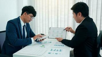 Teamwork with business people analysis cost graph on desk at meeting room. photo