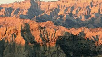 Panorama red sunset light over beautiful rock formations in Mijniskure famous site in Vashlovani national park. Georgia caucasus natural beauty landscapes video