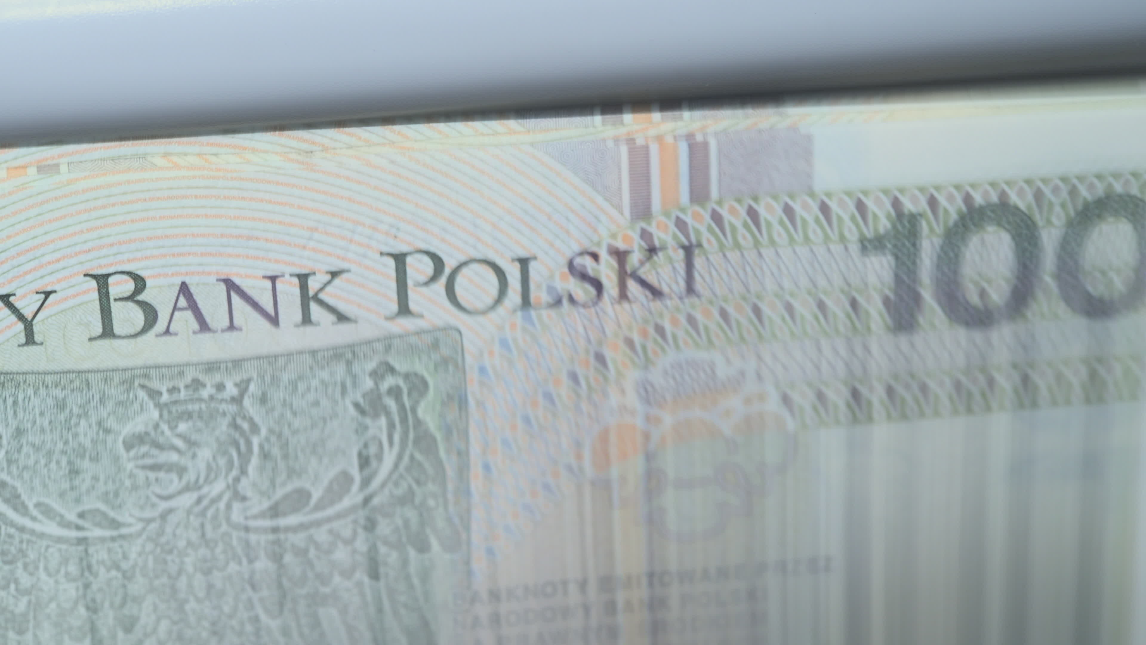 Close Up Of Money Counting Machine Spinning Wheels Making Noise While Totaling Amount Of Foreign