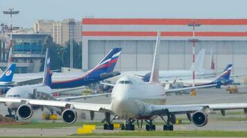 MOSCOW, RUSSIAN FEDERATION SEPTEMBER 12, 2020 - Rossiya Airlines Boeing 747 prepares for departure from Sheremetyevo International airport. video