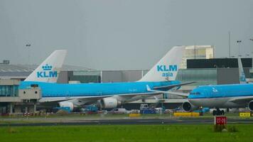 AMSTERDAM, THE NETHERLANDS JULY 26, 2017 - KLM Royal Dutch Airlines Airbus A330 PH AOB taxiing after landing and black hawk, Shiphol Airport, Amsterdam, Holland video