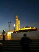 Jeddah, Saudi Arabia, June 2023 - A beautiful night view of the minarets and dome of the Hassan Enany Mosque on the Jeddah Corniche. photo