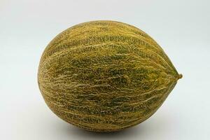 A fresh yellow melon isolated on white background photo