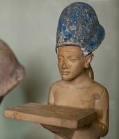 Cairo Egypt  March 18 2023 Statue of Ahkenaten wearing the blue crown. The Egyptian Museum in Cairo. photo