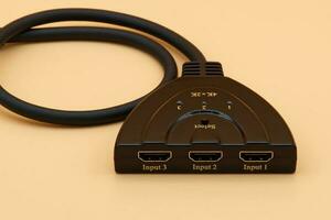 HDMI multiple selector isolated on yellow background. photo