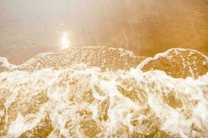 White foam and brown sand. at the sea of Thailand, Empty sea floor and beach with copy space photo