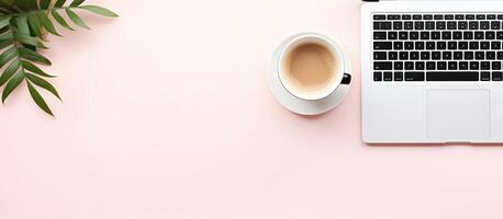 A laptop and a cup of coffee on a pink surface created with technology photo