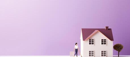 A person standing in front of a model house created with technology photo