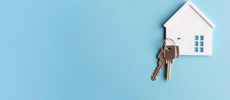 A house key hanging from a house shaped keychain created with Generative AI technology photo