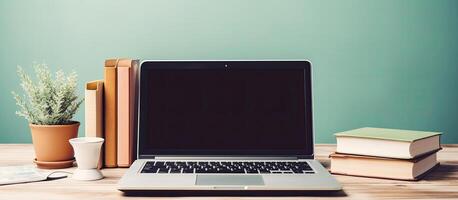 A laptop computer sitting on top of a wooden desk created with technology photo