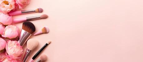 A bunch of makeup brushes and flowers on a pink background created with technology photo