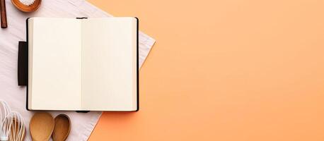 An open notebook sitting on top of a table next to utensils created with technology photo