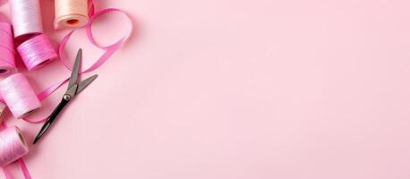 A pair of scissors and pink thread on a pink background created with technology photo
