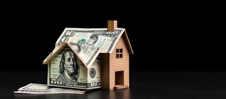 A house made out of money sitting on top of a table created with Generative AI technology photo