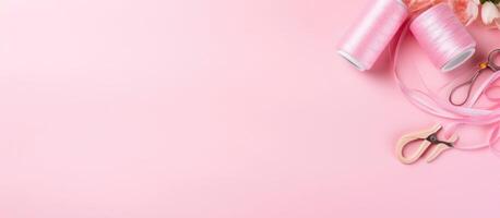 A pair of scissors and a pink ribbon on a pink background created with technology photo