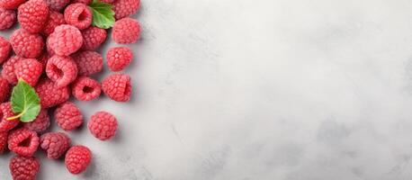 A pile of raspberries with leaves on top created with technology photo