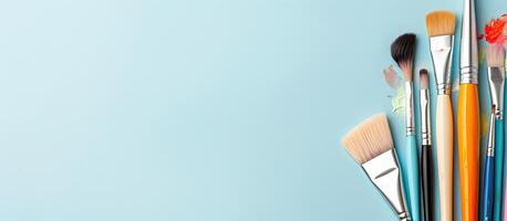 A group of brushes sitting on top of a blue surface created with technology photo