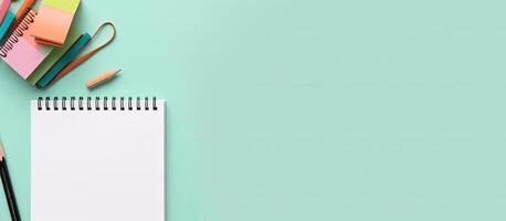 A notepad, pencils, and markers on a desk created with technology photo