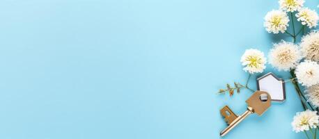 A bunch of flowers and a key on a blue background created with technology photo