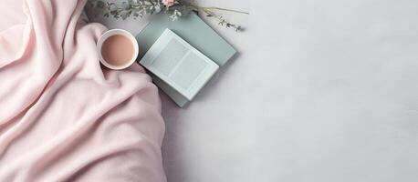 A cup of coffee and an open book on a pink blanket created with technology photo