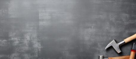 A hammer and a hammer on a blackboard created with technology photo