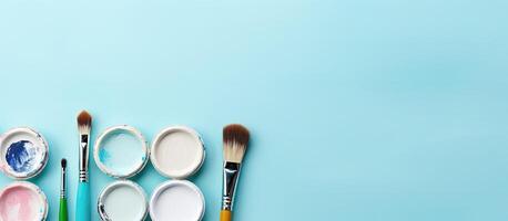 A group of paint brushes sitting on top of a blue surface created with technology photo