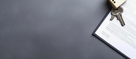 A piece of paper with a key attached to it created with technology photo