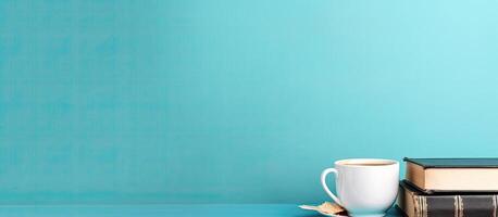 A cup of coffee sitting on top of a stack of books created with Generative AI technology photo