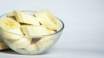 Banana slices in bowl photo