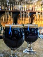 dark stout beer in glass at the brewery photo