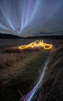 Flame light painting landscape with beautiful motion clouds created with technology photo