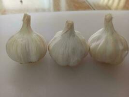 garlic on a white background. Garlic is a spice for cooking. photo