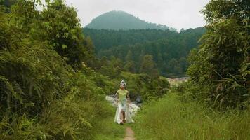 a princess in a white dress was scared while walking alone in the middle of the forest video