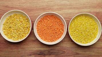 Bowl of uncooked dhal on table top view video