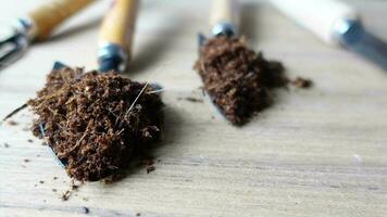 Coco peat and gardening tools a table with copy space video