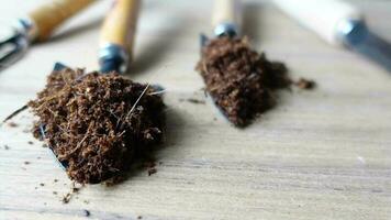 Coco peat and gardening tools a table with copy space video