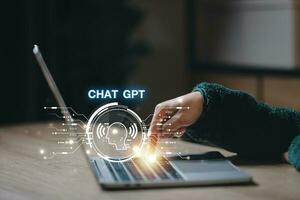 ChatGPT Chat with AI or Artificial Intelligence using an artificial intelligence chatbot developed by OpenAI. photo