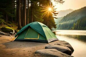 Camping green tent in forest near lake photo