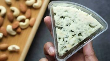 Close up of fresh cheese , cashed and almond nut on table video